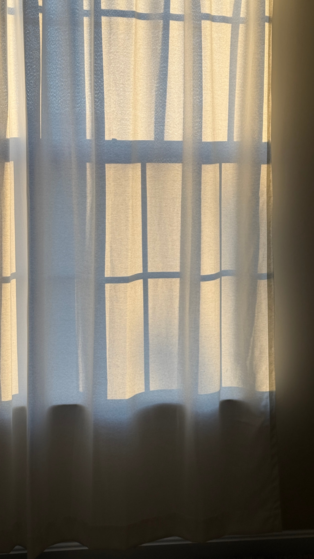 Morning light falling through a linen curtain